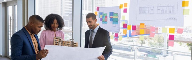front-view-young-african-american-female-architect-holding-model-while-young-african-american-young-caucasian-male-architect-hold-blue-print-three-them-are-stand