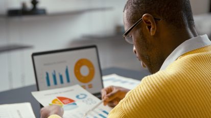 young-african-male-with-laptop-work-home-office_769609-1593